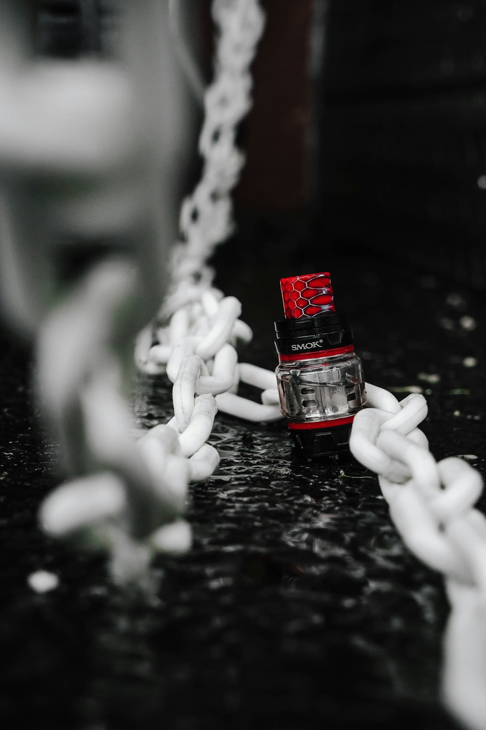 Close-up of a rebuildable atomizer coil head threaded onto a sub-ohm tank